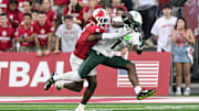 Oct 18, 2025; Bloomington, Indiana, USA; Indiana Hoosiers defensive back D'Angelo Ponds (5) breaks up a pass intended for Michigan State Spartans wide receiver Omari Kelly (1) during the second half at Memorial Stadium. Mandatory Credit: Robert Goddin-Imagn Images