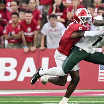 Oct 18, 2025; Bloomington, Indiana, USA; Indiana Hoosiers defensive back D'Angelo Ponds (5) breaks up a pass intended for Michigan State Spartans wide receiver Omari Kelly (1) during the second half at Memorial Stadium. Mandatory Credit: Robert Goddin-Imagn Images