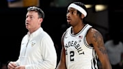 Vanderbilt basketball head coach Mark Byington talks with guard M.J. Collins Jr. (2) during an NCAA college basketball game against California Wednesday, Nov. 13, 2024, in Nashville, Tenn.