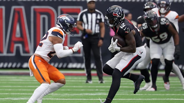 Nov 2, 2025; Houston, Texas, USA; Houston Texans wide receiver Nico Collins (12) makes a catch against Denver Broncos safety 