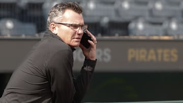 Jun 5, 2024; Pittsburgh, Pennsylvania, USA;  Pittsburgh Pirates general manager Ben Cherington speaks on the phone in the dugout before the Pirates host the Los Angeles Dodgers at PNC Park. Mandatory Credit: Charles LeClaire-Imagn Images