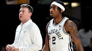 Vanderbilt basketball head coach Mark Byington talks with guard M.J. Collins Jr. (2) during an NCAA college basketball game against California Wednesday, Nov. 13, 2024, in Nashville, Tenn.