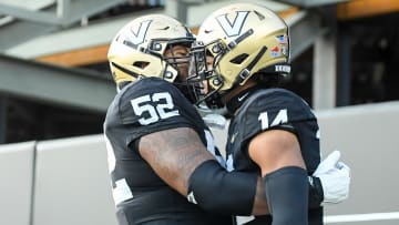 Sep 30, 2023; Nashville, Tennessee, USA;  Vanderbilt Commodores offensive lineman Kevo Wesley (52) celebrates the touchdown of wide receiver Will Sheppard (14) during the second half at FirstBank Stadium. Mandatory Credit: Steve Roberts-USA TODAY Sports