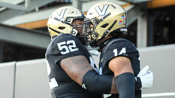 Sep 30, 2023; Nashville, Tennessee, USA;  Vanderbilt Commodores offensive lineman Kevo Wesley (52) celebrates the touchdown of wide receiver Will Sheppard (14) during the second half at FirstBank Stadium. Mandatory Credit: Steve Roberts-USA TODAY Sports