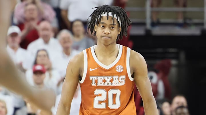 Feb 26, 2025; Fayetteville, Arkansas, USA; Texas Longhorns guard Tre Johnson (20) reacts after making a three-point shot in overtime against the Arkansas Razorbacks at Bud Walton Arena.