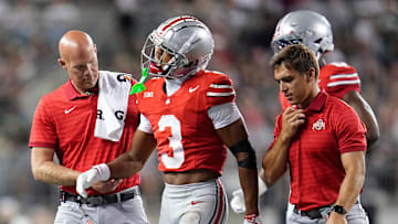 Ohio State Buckeyes cornerback Lorenzo Styles Jr. (3) is helped off the field by trainers during the second half of the NCAA football game against the Ohio Bobcats at Ohio Stadium on Sept. 13, 2025. Ohio State won 37-9.