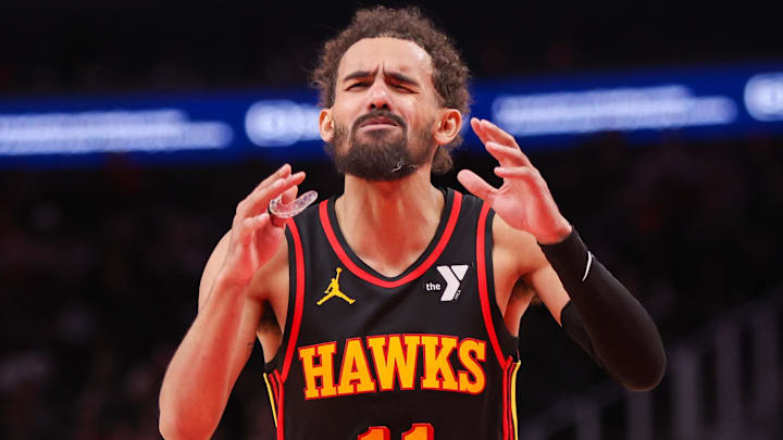 Jan 23, 2025; Atlanta, Georgia, USA; Atlanta Hawks guard Trae Young (11) reacts to a foul call by referee Pat Fraher (not pictured) against the Toronto Raptors in the fourth quarter at State Farm Arena. Mandatory Credit: Brett Davis-Imagn Images
