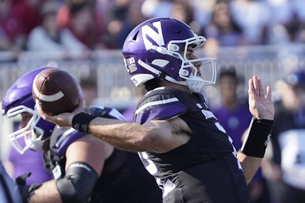 Northwestern Wildcats quarterback Jack Lausch (12) passes the ball.