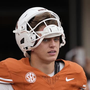 Texas Longhorns quarterback Arch Manning pauses while warming up before a game against the Vanderbilt Commodores at Darrell K Royal-Texas Memorial Stadium.