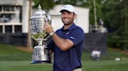 May 18, 2025; Charlotte, North Carolina, USA; Scottie Scheffler holds the Wanamaker Trophy after winning the PGA Championship golf tournament at Quail Hollow. Mandatory Credit: Jim Dedmon-Imagn Images