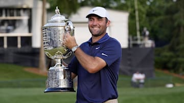 May 18, 2025; Charlotte, North Carolina, USA; Scottie Scheffler holds the Wanamaker Trophy after winning the PGA Championship golf tournament at Quail Hollow. Mandatory Credit: Jim Dedmon-Imagn Images