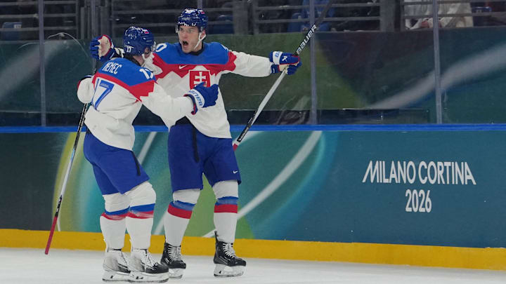 Juraj Slafkovsky of Slovakia celebrates scoring their first goal with Simon Nemec of Slovakia during the Milano Cortina 2026 Olympic Winter Games: James Lang-Imagn Images