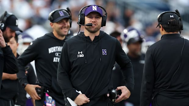 Northwest Wildcats head coach David Braun walks the sideline during the fourth quarter 