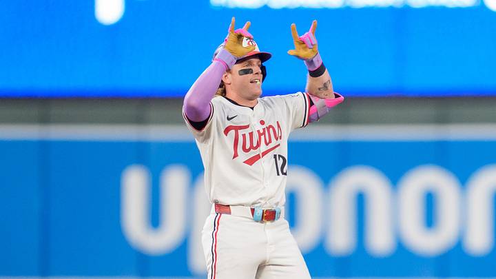 Jul 26, 2025; Minneapolis, Minnesota, USA; Minnesota Twins left fielder Harrison Bader (12) hits a ground rule double in the eighth inning off Washington Nationals pitcher Jackson Rutledge (79) at Target Field. Mandatory Credit: Matt Blewett-Imagn Images