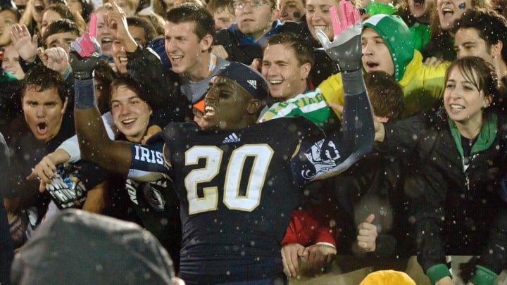 Oct. 13, 2012; South Bend, IN, USA; Notre Dame Fighting Irish running back Cierre Wood (20) signals 6-0 after Notre Dame defeated the Stanford Cardinal 20-13 in overtime at Notre Dame Stadium. 