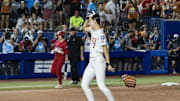 Jun 6, 2025; Oklahoma City, OK, USA;  Texas Longhorns pitcher Teagan Kavan (17) drops her glove and takes off her mask after winning the National Championship 10-4 against Texas Tech Red Raiders in game three of the NCAA Softball Women's College World Series finals at Devon Park. Mandatory Credit: Brett Rojo-Imagn Images