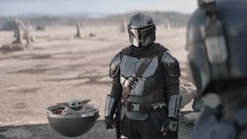 (L-R): Grogu, Din Djarin (Pedro Pascal) and Paz Vizsla (Tait Fletcher) in Lucasfilm's THE MANDALORIAN, season three, exclusively on Disney+. ©2023 Lucasfilm Ltd. & TM. All Rights Reserved.