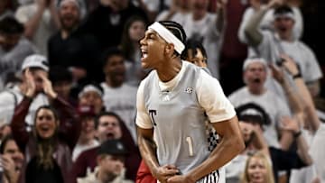 Feb 15, 2025; College Station, Texas, USA; Texas A&M Aggies guard Zhuric Phelps (1) reacts after dunking the ball during the second half against the Arkansas Razorbacks at Reed Arena. Mandatory Credit: Maria Lysaker-Imagn Images 