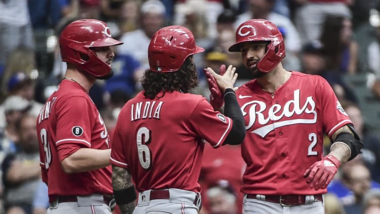 Cincinnati Reds right fielder Nick Castellanos (2) celebrates with Jonathan India and Jesse Winker.