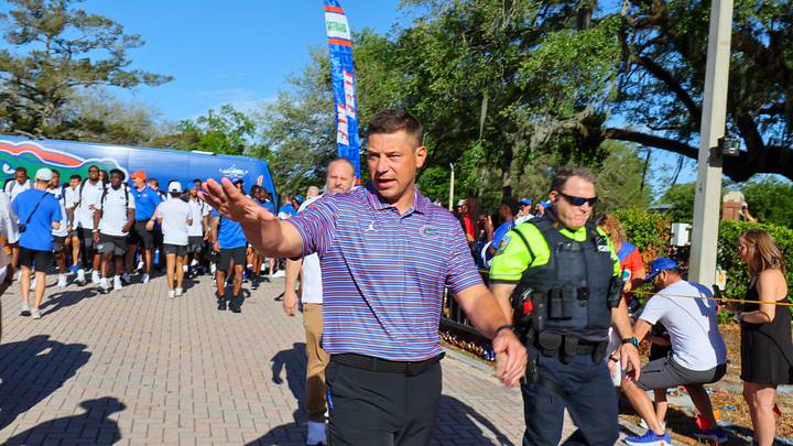 Florida Head Coach Jon Sumrall greats fans as he heads to the locker room during Gator Walk before the Orange and Blue game at Steve Spurrier Field at Ben Hill Griffin Stadium in Gainesville, FL on Saturday, April 11, 2026. [Alan Youngblood/Gainesville Sun]