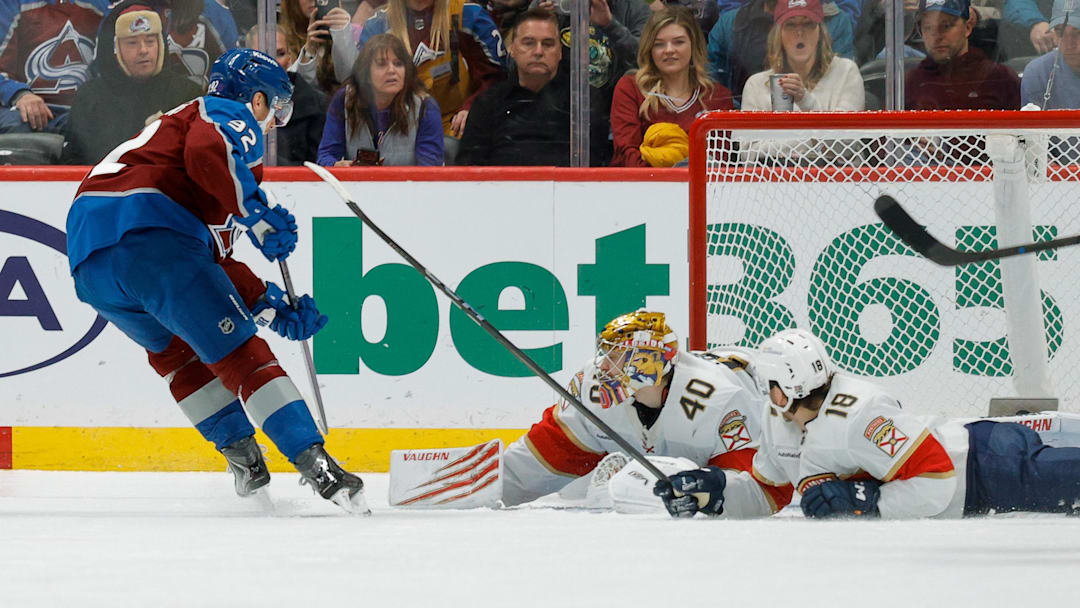 Dec 11, 2025; Denver, Colorado, USA; Colorado Avalanche left wing Gabriel Landeskog (92) scores a goal against Florida Panthers goaltender Daniil Tarasov (40) as left wing Noah Gregor (18) looks on in the third period at Ball Arena. Mandatory Credit: Isaiah J. Downing-Imagn Images