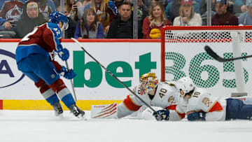 Dec 11, 2025; Denver, Colorado, USA; Colorado Avalanche left wing Gabriel Landeskog (92) scores a goal against Florida Panthers goaltender Daniil Tarasov (40) as left wing Noah Gregor (18) looks on in the third period at Ball Arena. Mandatory Credit: Isaiah J. Downing-Imagn Images