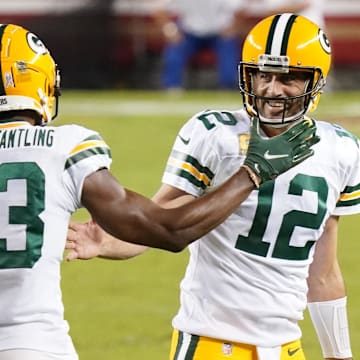 Nov 5, 2020; Santa Clara, California, USA; Green Bay Packers wide receiver Marquez Valdes-Scantling (83) celebrates with quarterback Aaron Rodgers (12) after catching a pass to score a touchdown against the San Francisco 49ers during the second quarter at Levi's Stadium. Mandatory Credit: Kyle Terada-Imagn Images