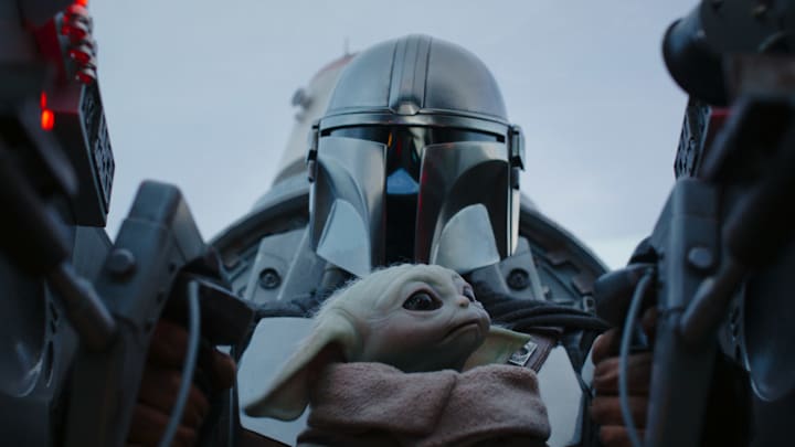 (L-R): Din Djarin (Pedro Pascal) and Grogu in Lucasfilm's THE MANDALORIAN, season three, exclusively on Disney+. ©2023 Lucasfilm Ltd. & TM. All Rights Reserved.