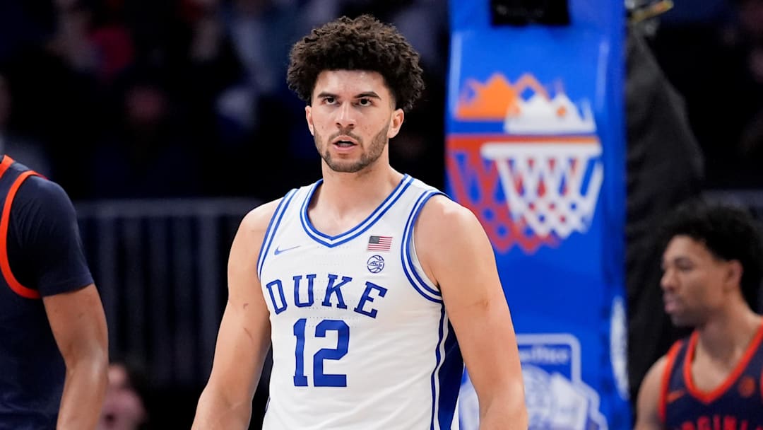 Mar 14, 2026; Charlotte, NC, USA; Duke Blue Devils forward Cameron Boozer (12) celebrates after a play against the Virginia Cavaliers during the men's ACC Conference Tournament Championship at Spectrum Center. Mandatory Credit: Jim Dedmon-Imagn Images