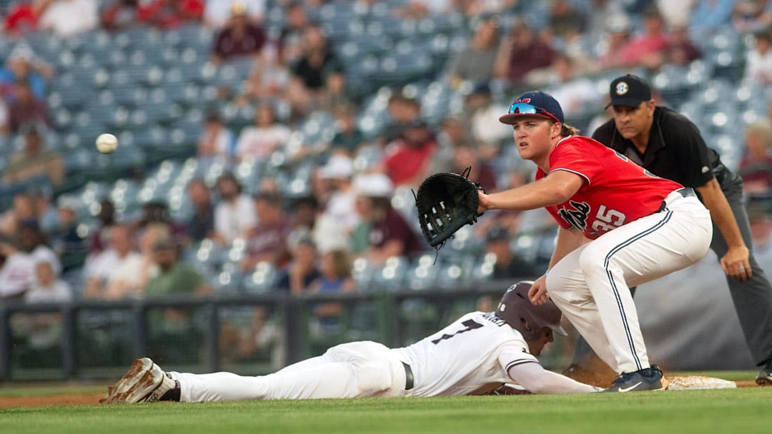 MSU's Conner Hujsak (7) is safe at first as Ole Miss first baseman Will Furniss (35) waits for the throw from the pitcher at Trustmark Park in Pearl, Miss, Wednesday, May 1, 2024.