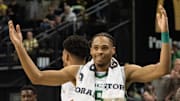 Oregon’s Keeshawn Barthelemy exults the crowd from the bench during the second half against Rutgers at Matthew Knight Arena Sunday, Feb. 16, 2025.