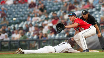 MSU's Conner Hujsak (7) is safe at first as Ole Miss first baseman Will Furniss (35) waits for the throw from the pitcher at Trustmark Park in Pearl, Miss, Wednesday, May 1, 2024.
