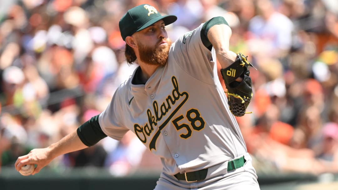 Apr 28, 2024; Baltimore, Maryland, USA;  Oakland Athletics starting pitcher Paul Blackburn (58) delivers a pitch during the first inning against the Baltimore Orioles at Oriole Park at Camden Yards. Mandatory Credit: James A. Pittman-USA TODAY Sports