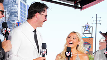 Paul Skenes #30 of the Pittsburgh Pirates and Livvy Dunne talk with MLB Network hosts during the 2024 All-Star Red Carpet Show
