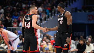 Mar 31, 2025; Washington, District of Columbia, USA; Miami Heat guard Tyler Herro (14) and center Bam Adebayo (13) react during the third quarter against the Washington Wizards at Capital One Arena. Mandatory Credit: Reggie Hildred-Imagn Images