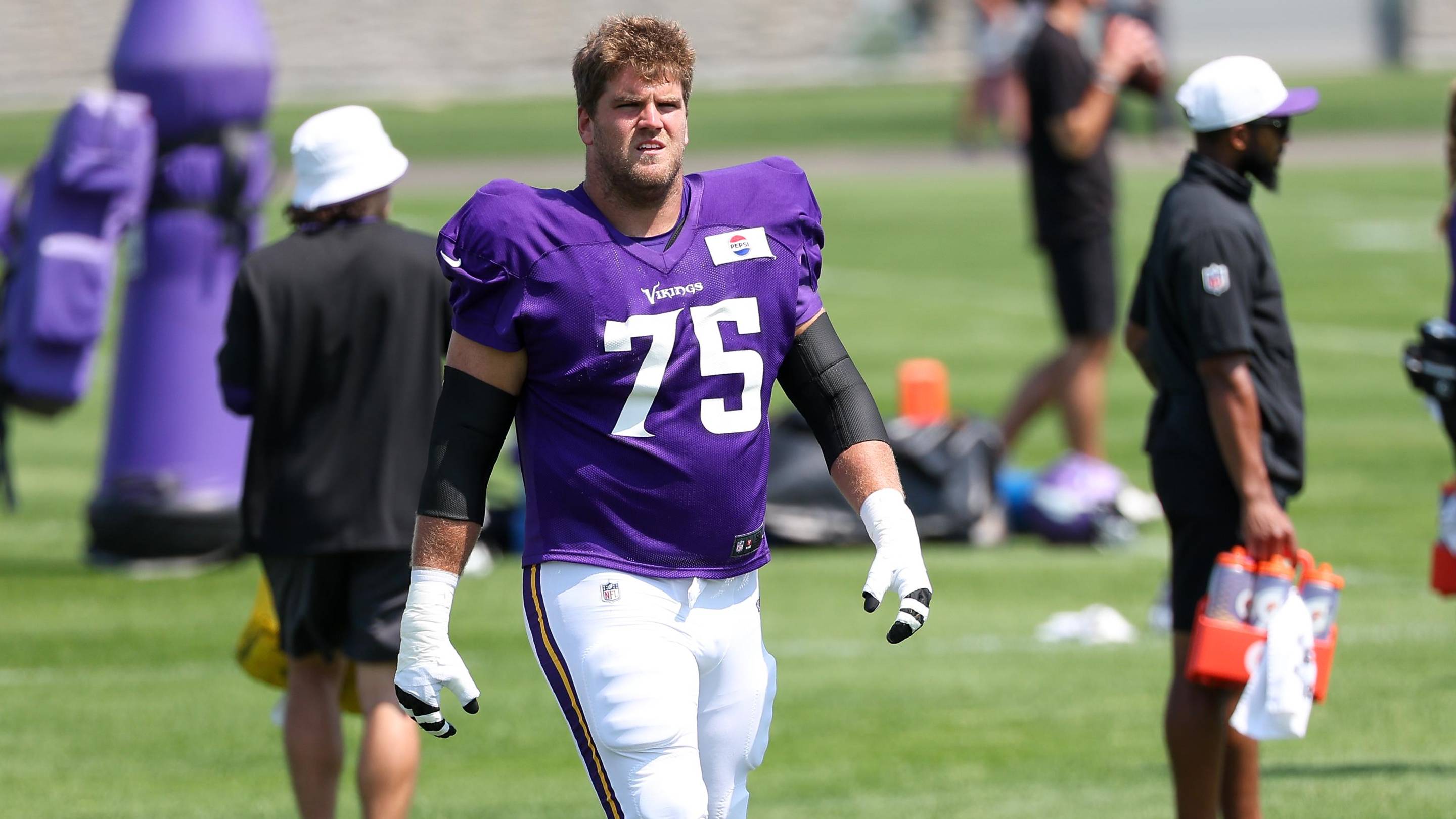 Jul 28, 2025; Eagan, MN, USA; Minnesota Vikings offensive tackle Brian O'Neill (75) takes part in drills during the teams training camp at the Minnesota Vikings Training Facility.