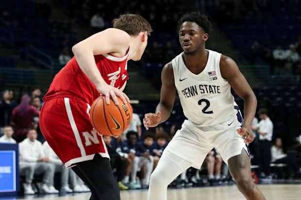 Penn State Nittany Lions guard D'Marco Dunn (2) defends as Nebraska Cornhuskers guard Connor Essegian (0) looks on.
