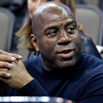 Mar 23, 2018; Omaha, NE, USA; NBA former player Magic Johnson watches during the first half between the Clemson Tigers and the Kansas Jayhawks in the semifinals of the Midwest regional of the 2018 NCAA Tournament at CenturyLink Center. Mandatory Credit: Kyle Terada-Imagn Images