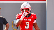 Oct 4, 2025; Raleigh, North Carolina, USA;  NC State Wolfpack running back Hollywood Smothers (3) celebrates a touchdown during the first half of the game against Campbell Fighting Camels at Carter-Finley Stadium. Mandatory Credit: Jaylynn Nash-Imagn Images