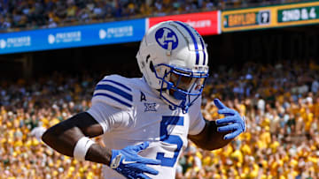 Darius Lassiter celebrates in the end zone after scoring a touchdown against Baylor