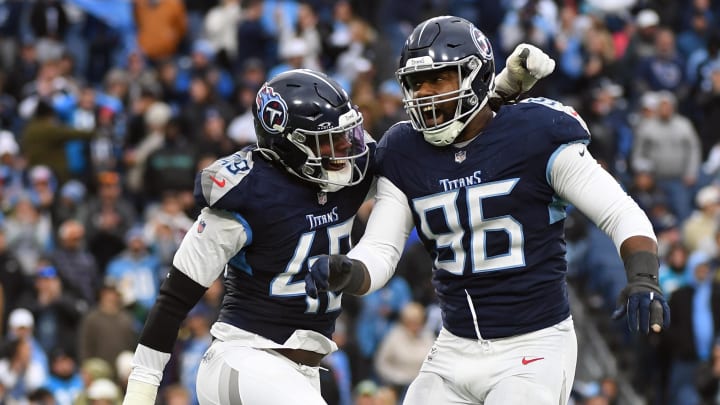 Nov 26, 2023; Nashville, Tennessee, USA; Tennessee Titans defensive end Denico Autry (96) and linebacker Arden Key (49) celebrate after a sack during the second half against the Carolina Panthers at Nissan Stadium. Mandatory Credit: Christopher Hanewinckel-USA TODAY Sports