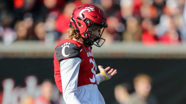 Nov 25, 2022; Cincinnati, Ohio, USA; Cincinnati Bearcats punter Mason Fletcher (31) punts against the Tulane Green Wave in the first half at Nippert Stadium. Mandatory Credit: Katie Stratman-USA TODAY Sports