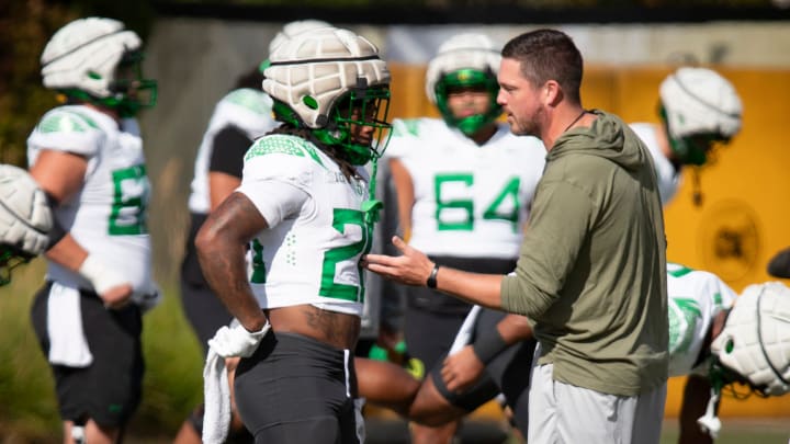 Oregon head coach Dan Lanning talks with running back Jordan James during practice with the Oregon Ducks Tuesday, Aug. 20, 2024 at the Hatfield-Dowlin Complex in Eugene, Ore.