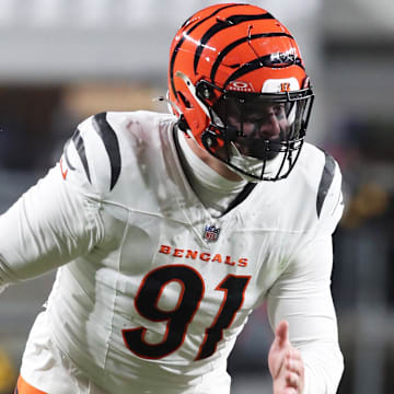 Jan 4, 2025; Pittsburgh, Pennsylvania, USA;  Cincinnati Bengals defensive end Trey Hendrickson (91) pass rushes at the line of scrimmage against the Pittsburgh Steelers during the second quarter at Acrisure Stadium. Mandatory Credit: Charles LeClaire-Imagn Images