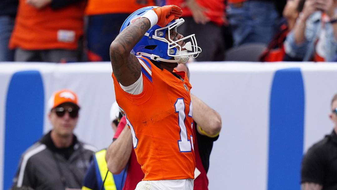 Oct 26, 2025; Denver, Colorado, USA;  Denver Broncos wide receiver Pat Bryant (13) celebrates scoring a touchdown in the second quarter against the Dallas Cowboys at Empower Field at Mile High. Mandatory Credit: Ron Chenoy-Imagn Images