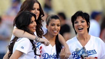 Kim Kardashian, Khloe Kardashian, Kourtney Kardashian, and Kris Jenner at batting practice before a Dodgers game. 