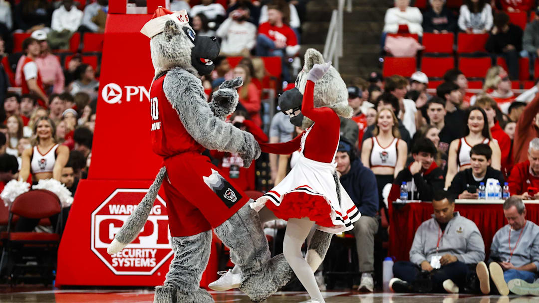 Jan 27, 2026; Raleigh, North Carolina, USA; NC State Wolfpack mascots dance during the second half of the game against the Syracuse Orange at Lenovo Center. Mandatory Credit: Jaylynn Nash-Imagn Images