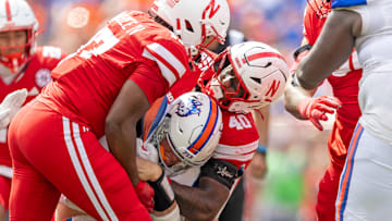 Dawson Merritt (40) assists on a tackle of Houston Christian quarterback Jake Weir.