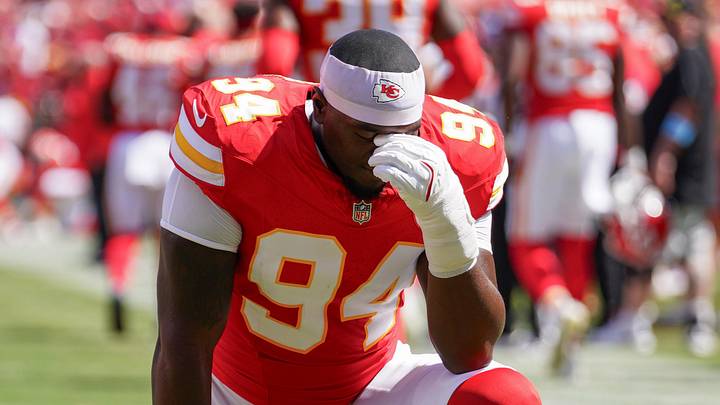 Aug 17, 2024; Kansas City, Missouri, USA; Kansas City Chiefs defensive end Malik Herring (94) kneels on field against the Detroit Lions prior to the game at GEHA Field at Arrowhead Stadium. Mandatory Credit: Denny Medley-Imagn Images