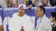 Sep 21, 2024; Provo, Utah, USA; Brigham Young Cougars alumni and Utah Jazz owner Ryan Smith speaks with Adrian Wojnarowski in the game against the Kansas State Wildcats at LaVell Edwards Stadium.
